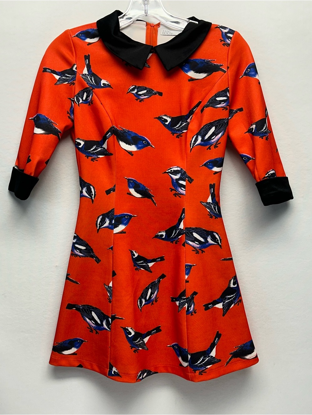 Junior’s small reddish Orange Bird Print Dress with Black Collar